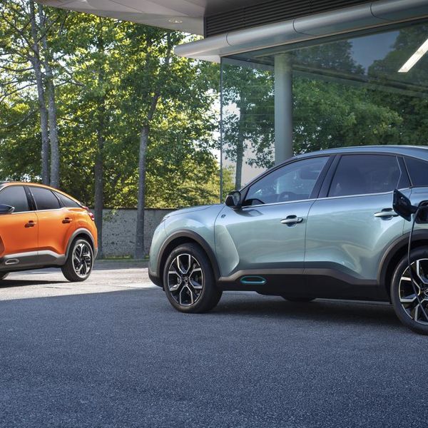 Orange and grey Citroen C4 parked charging